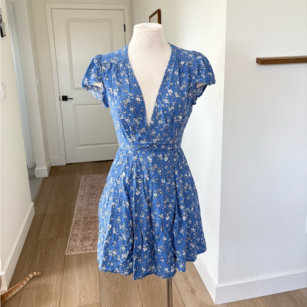 Blue floral mini dress with short sleeves and V-neckline